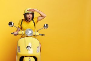 Mensch auf Motorroller